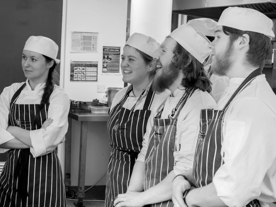 Student chefs listening blackandwhite