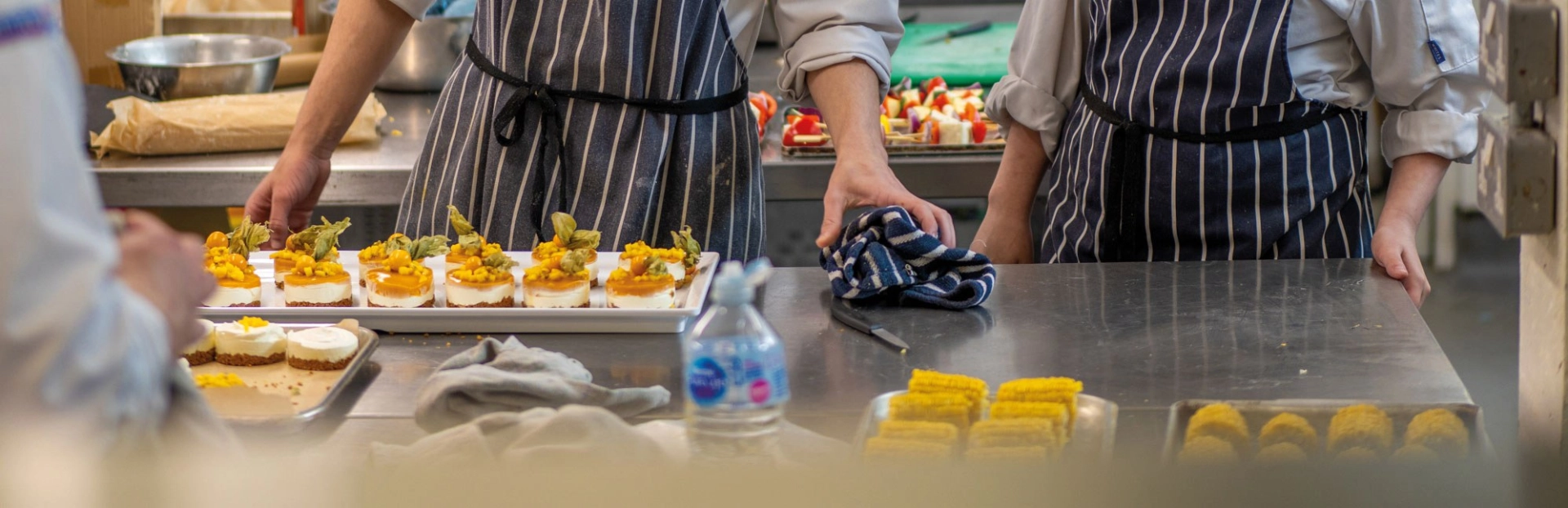Two students making desserts