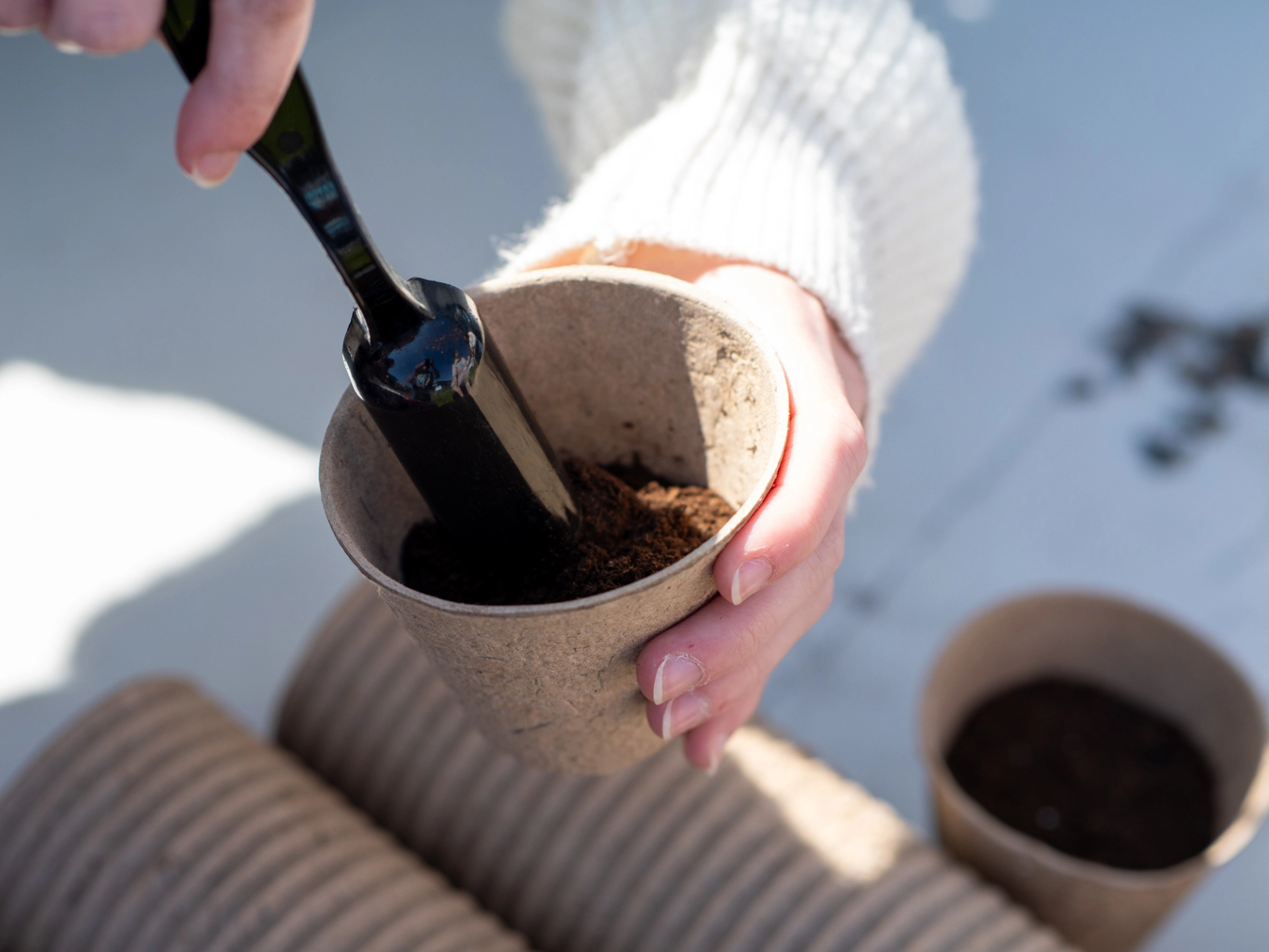 someone planting in a pot