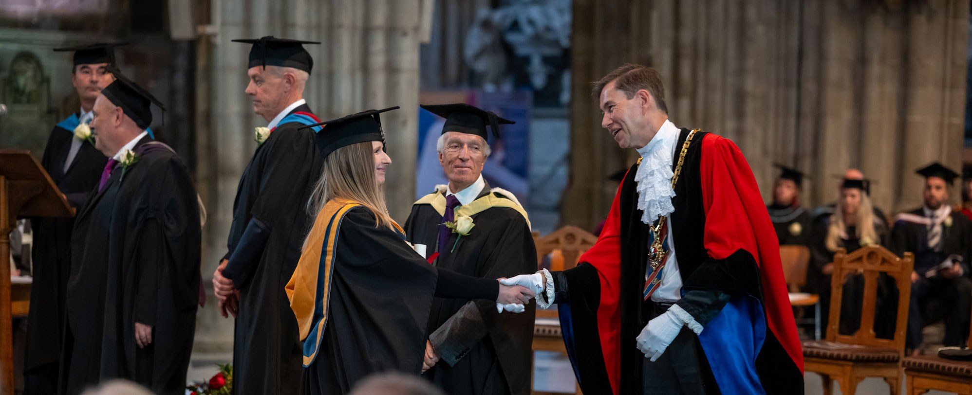 Graduand accepting diploma