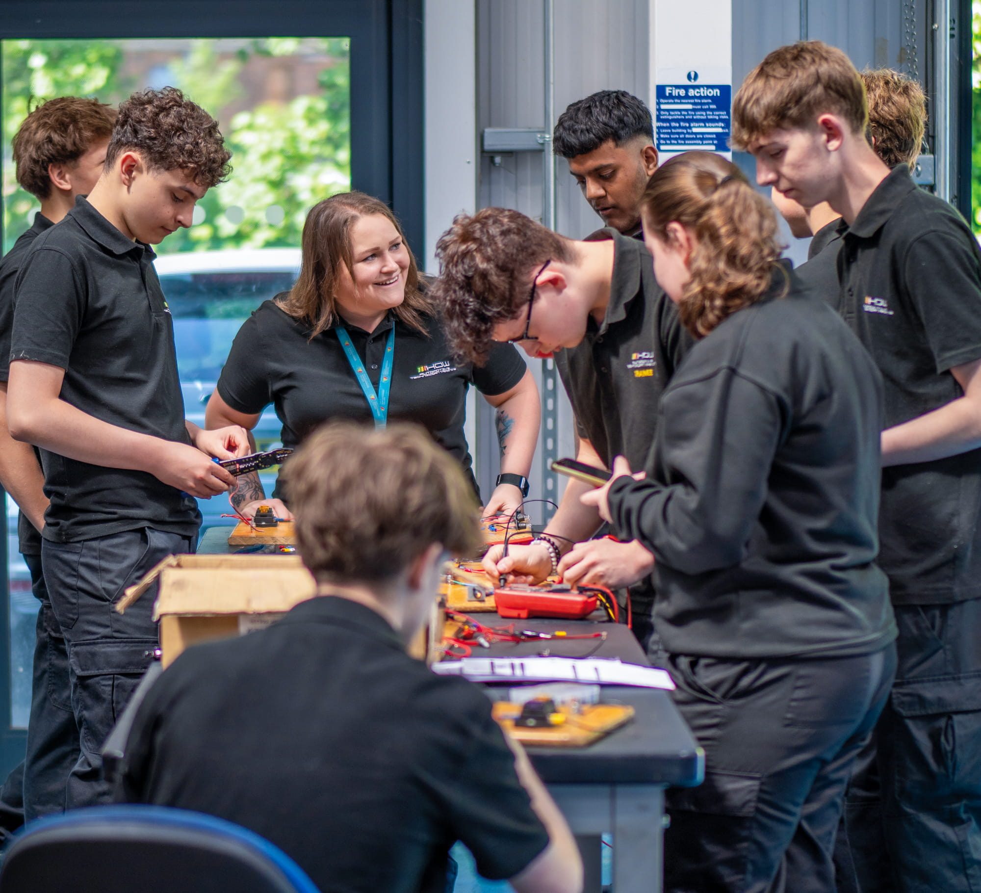 Teacher and group of students wiring