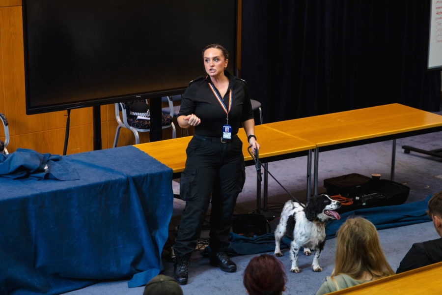 Woman hosts a talk with a dog on a leash