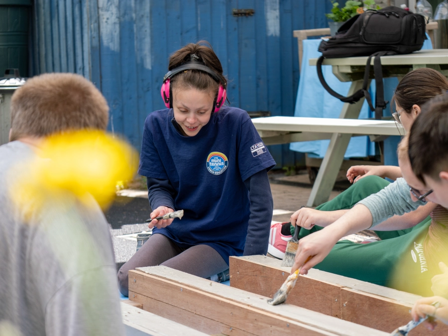 Students in garden making planters