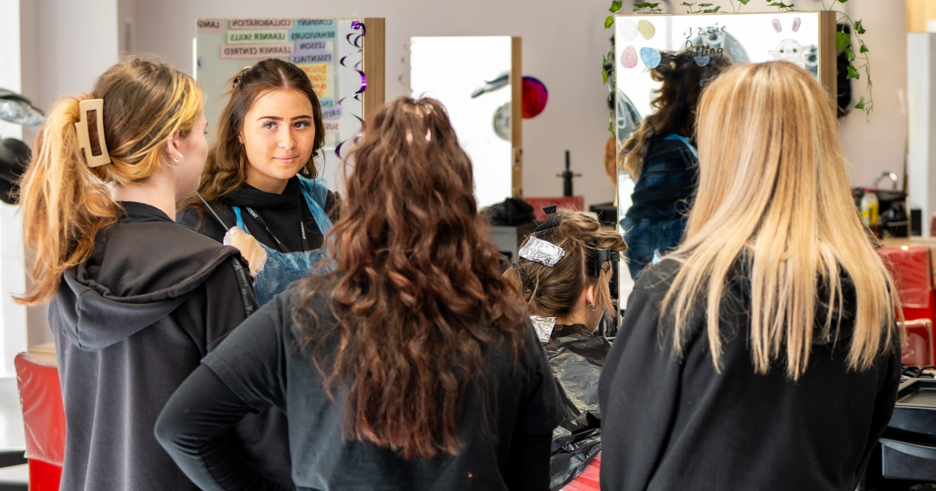Students chatting together in a hair salon