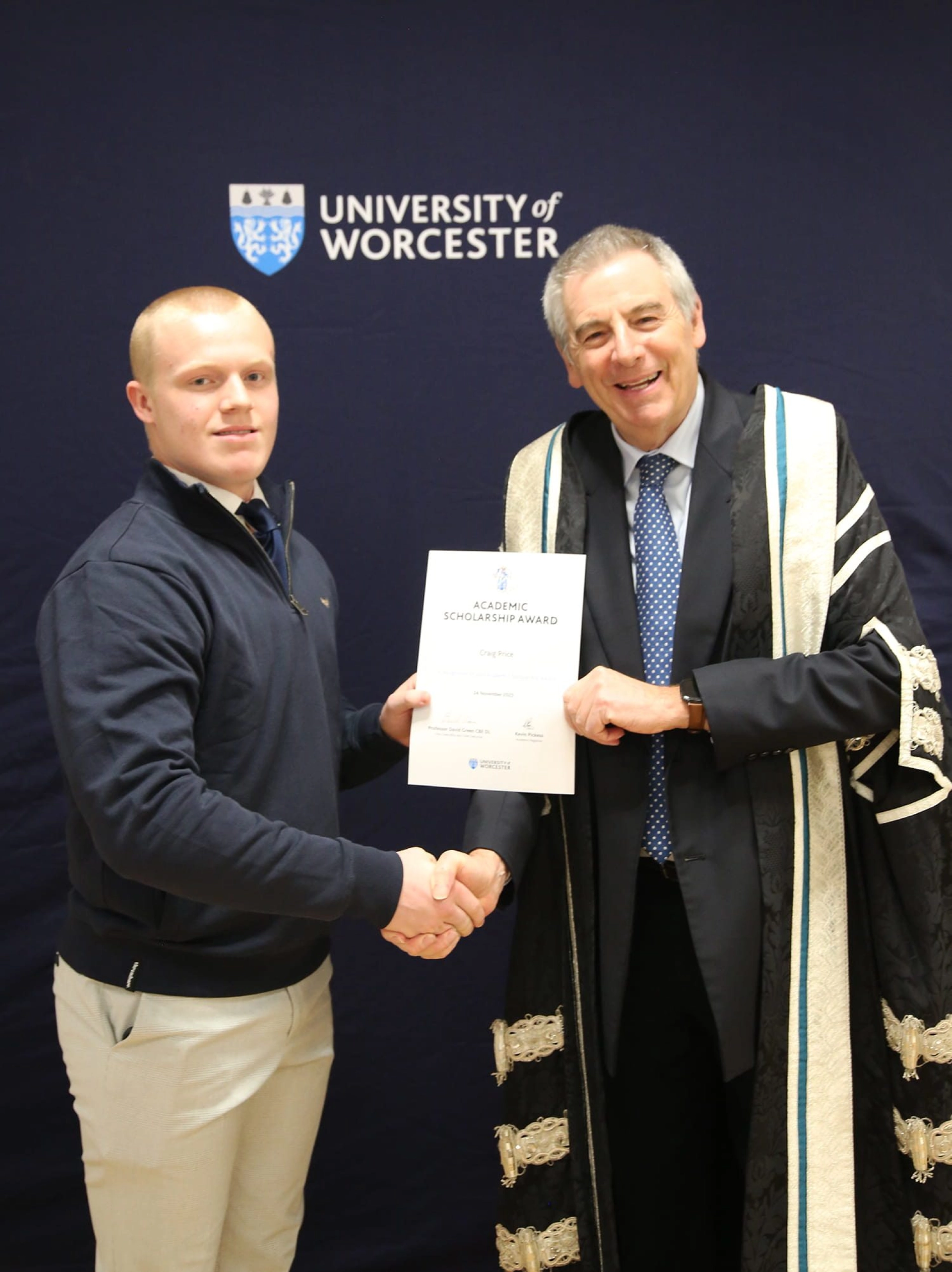 Picture of Craig receiving a certificate at Worcester University
