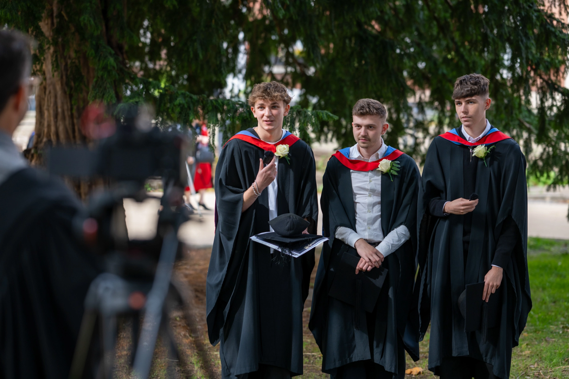 Students being interviewed at graduation