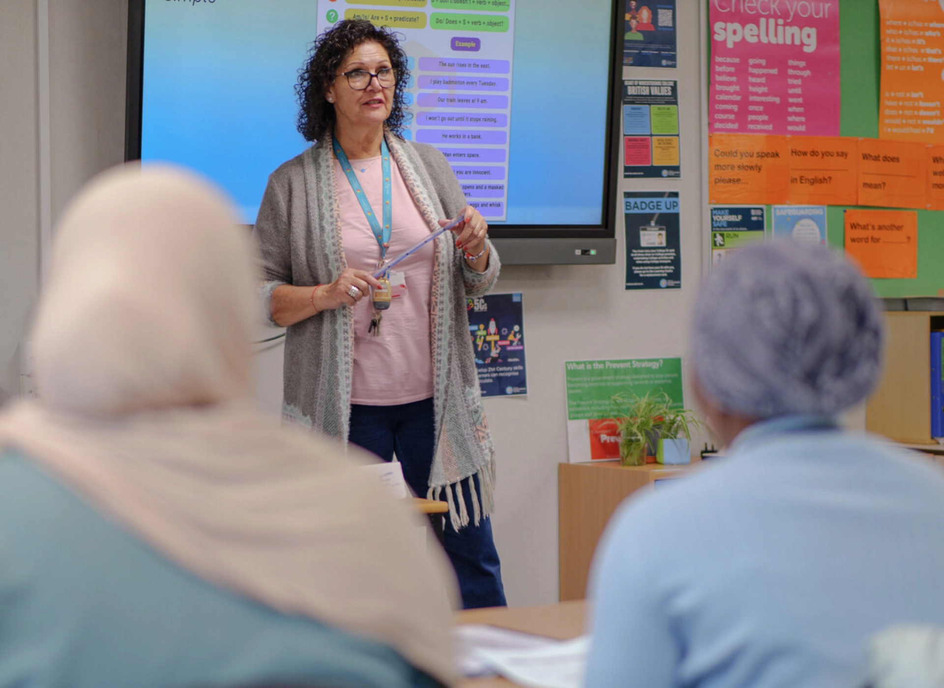 HoW College teacher teaching an adult class in a classroom